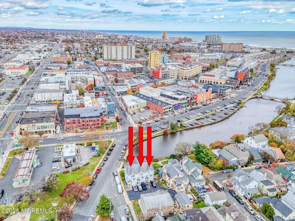 a view of house with garden and parking