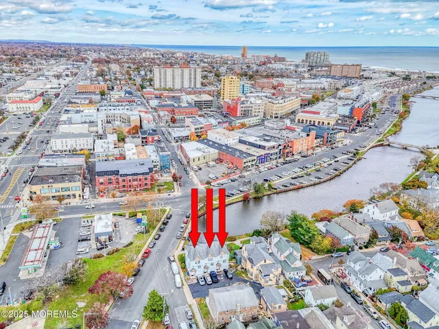 a view of house with garden and parking