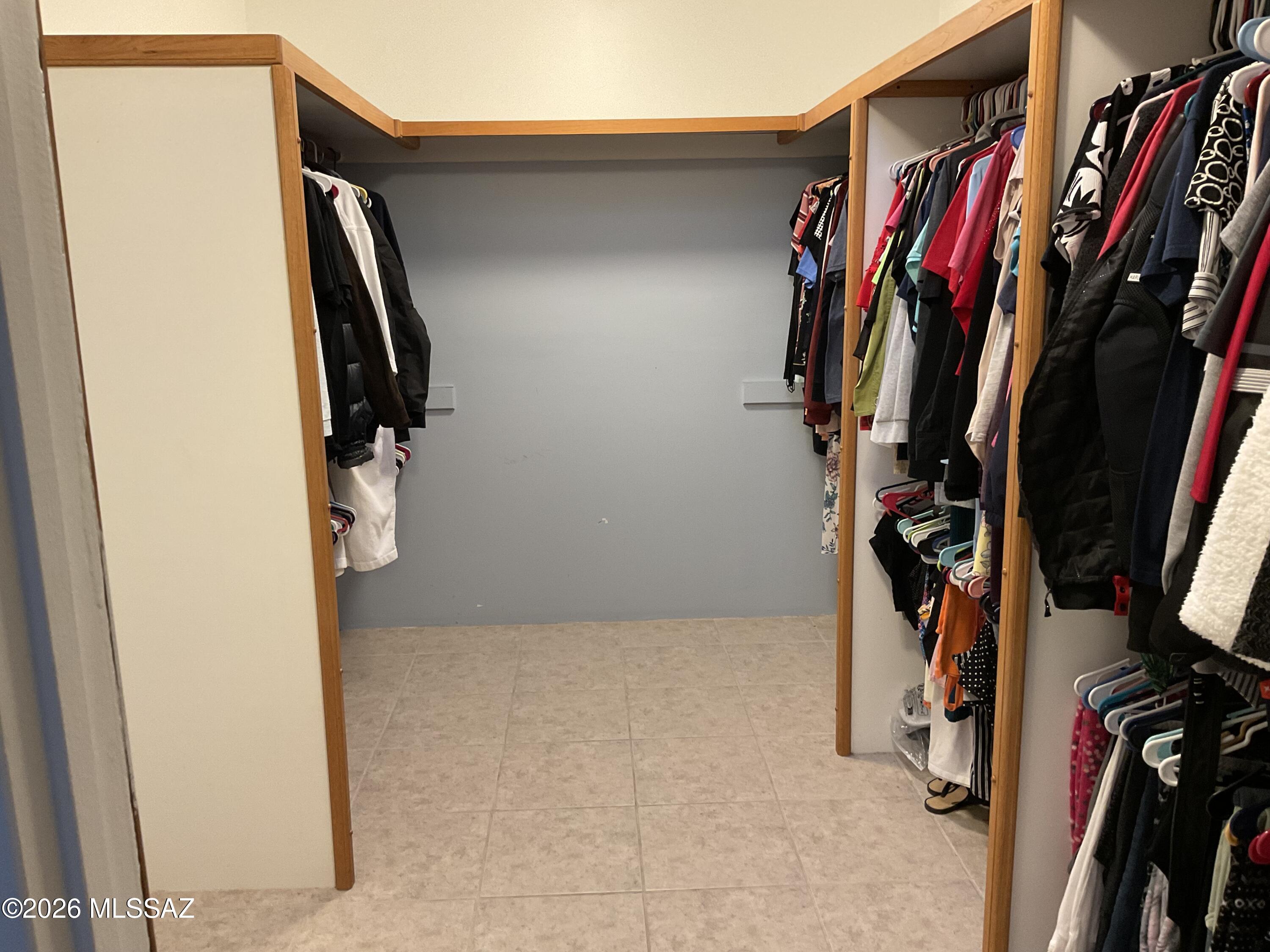 4060 North Swan Road Tucson, AZ 85718 - Photo 19 of 47 a view of walk in closet with clothes and shoes