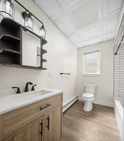 a bathroom with a sink and a toilet