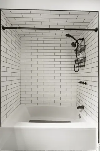 a bathroom with a shower and a bathtub