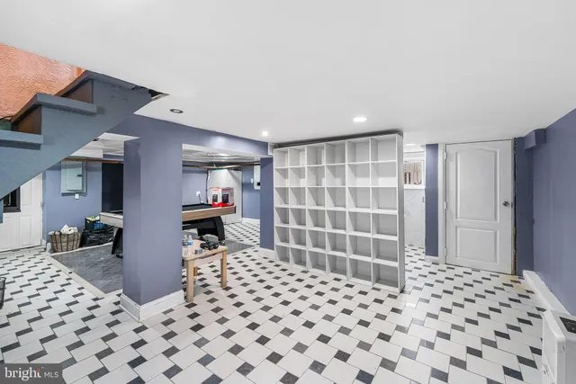 a bedroom with a bed and a view of closet