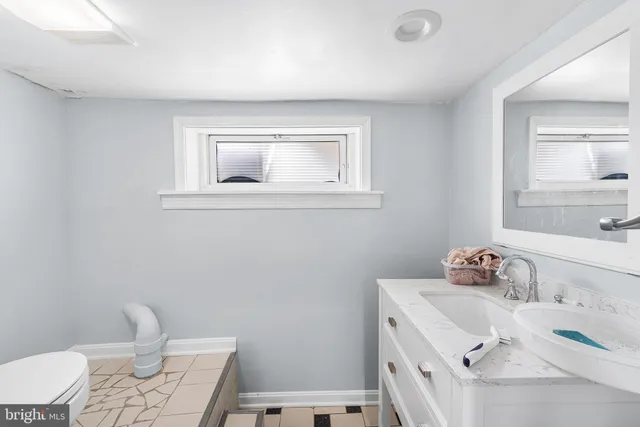 a bathroom with a sink and a toilet