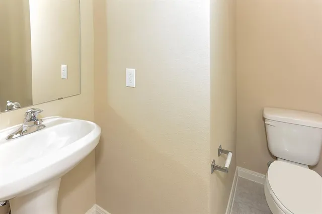 a bathroom with a sink and a toilet