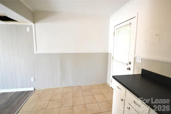 a kitchen with a sink cabinets and a stove top oven
