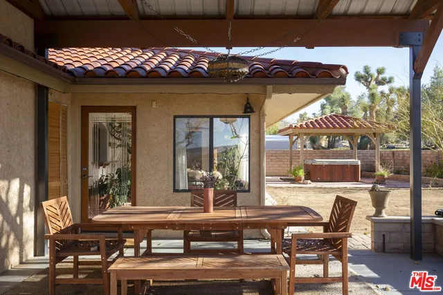 a view of a table and chairs in patio