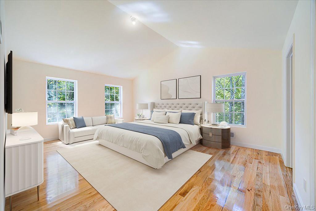 677 Marsh Road Glen Wild, NY 12738 - Photo 14 of 28 a bedroom with a large bed and a large window