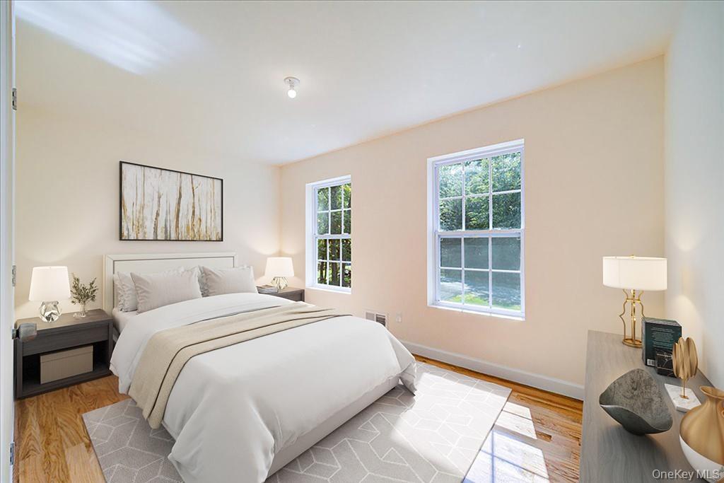 677 Marsh Road Glen Wild, NY 12738 - Photo 18 of 28 a spacious bedroom with a bed and a window