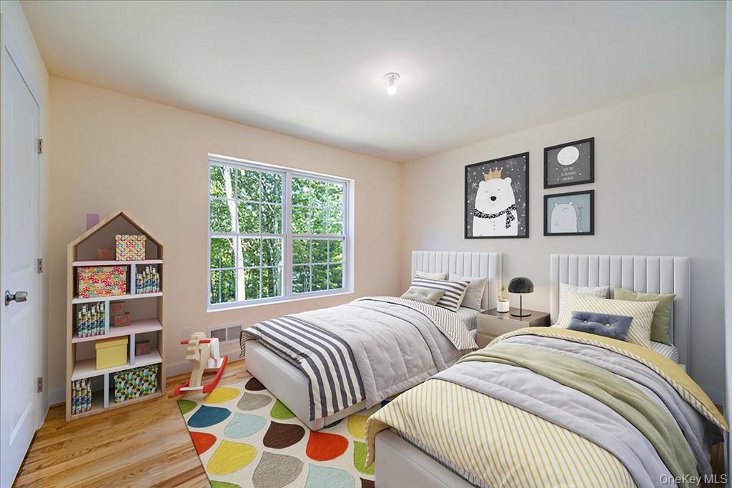 677 Marsh Road Glen Wild, NY 12738 - Photo 19 of 28 a bedroom with two beds and a large window