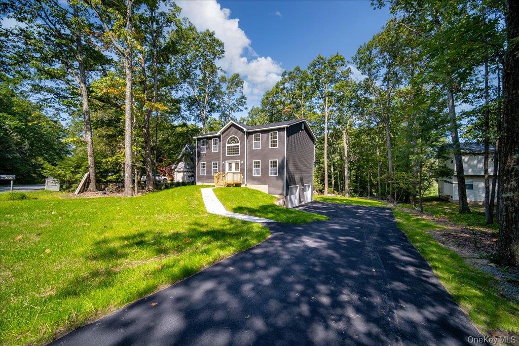 677 Marsh Road Glen Wild, NY 12738 - Photo 2 of 28 a view of a house with backyard and a tree