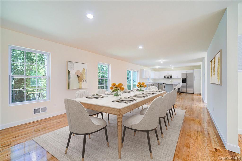 677 Marsh Road Glen Wild, NY 12738 - Photo 6 of 28 a view of a dining room with furniture and wooden floor