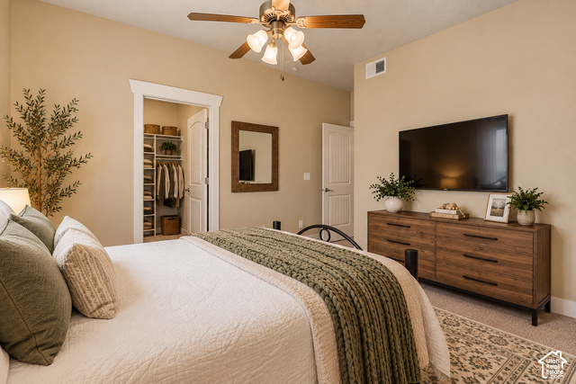 2156 Springtime Drive Saratoga Springs, UT 84045 - Photo 7 of 16 Ceiling fan with integrated lighting, recessed closet with built-in shelving, paneled interior doors, and neutral wall paint