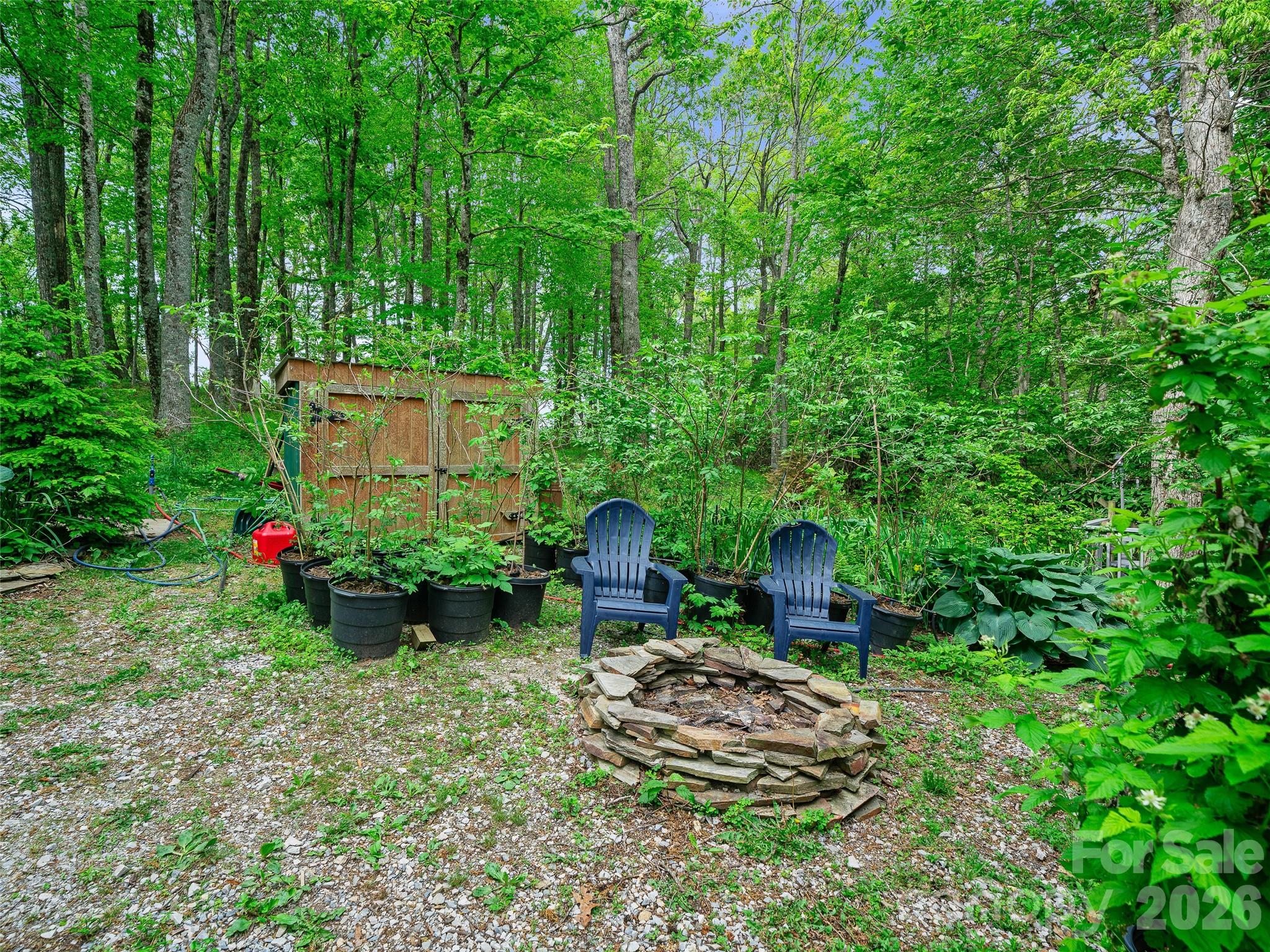 228 Continental Divide Road Spruce Pine, NC 28777 - Photo 29 of 48 a backyard of a house with seating space