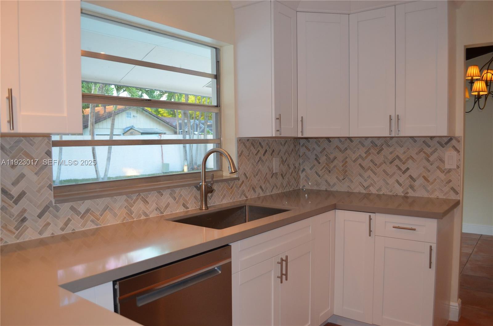 13491 Southwest 99th Terrace Miami, FL 33186 - Photo 17 of 41 a kitchen with a sink and large window