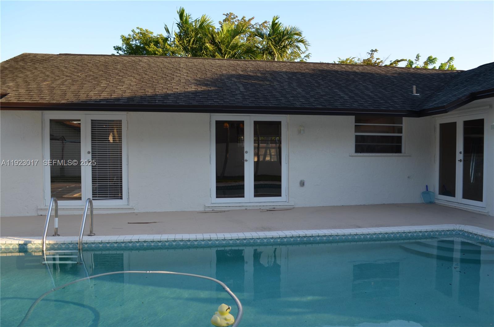 13491 Southwest 99th Terrace Miami, FL 33186 - Photo 28 of 41 a front view of a house with a yard