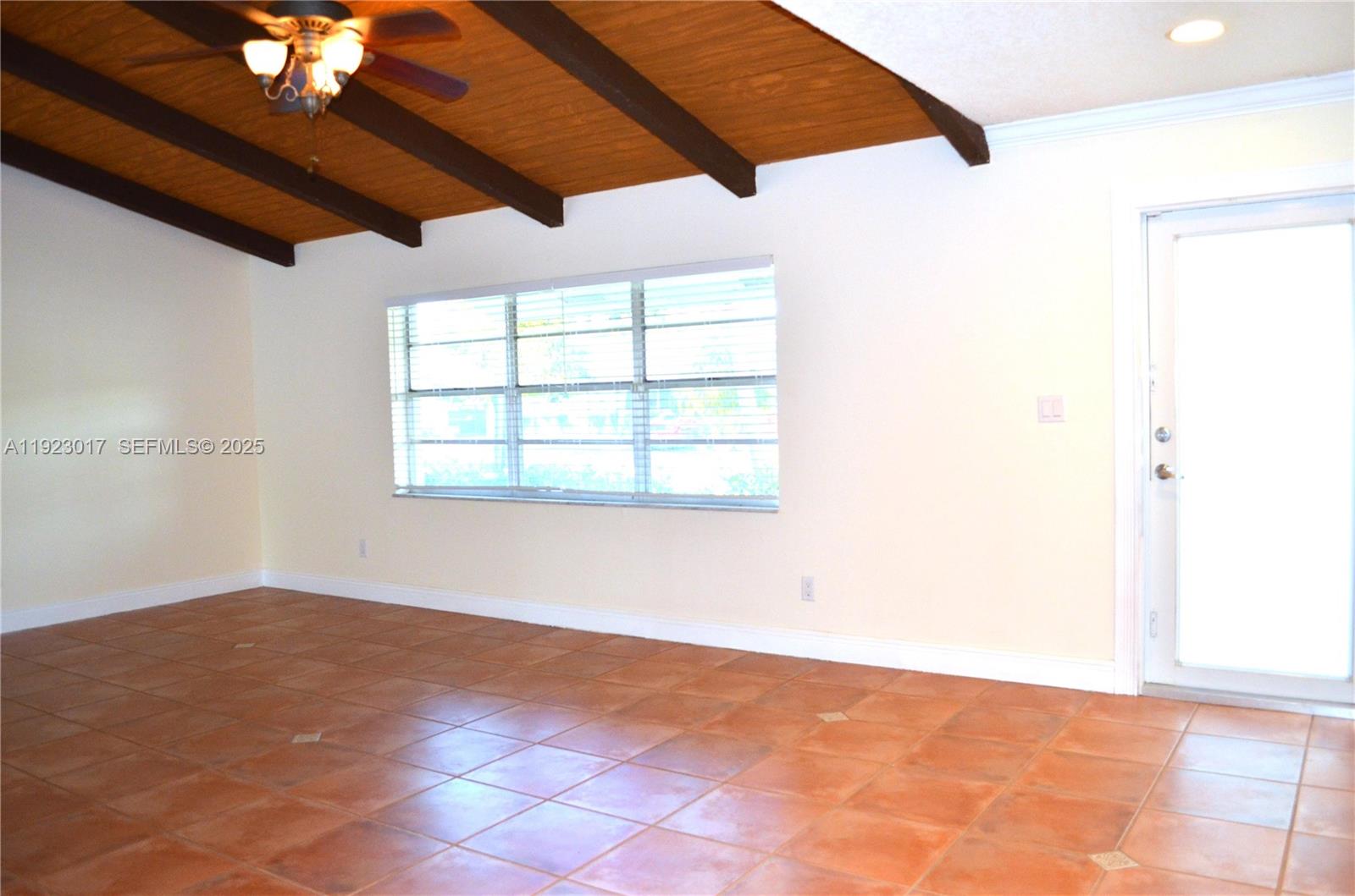 13491 Southwest 99th Terrace Miami, FL 33186 - Photo 3 of 41 an empty room with windows