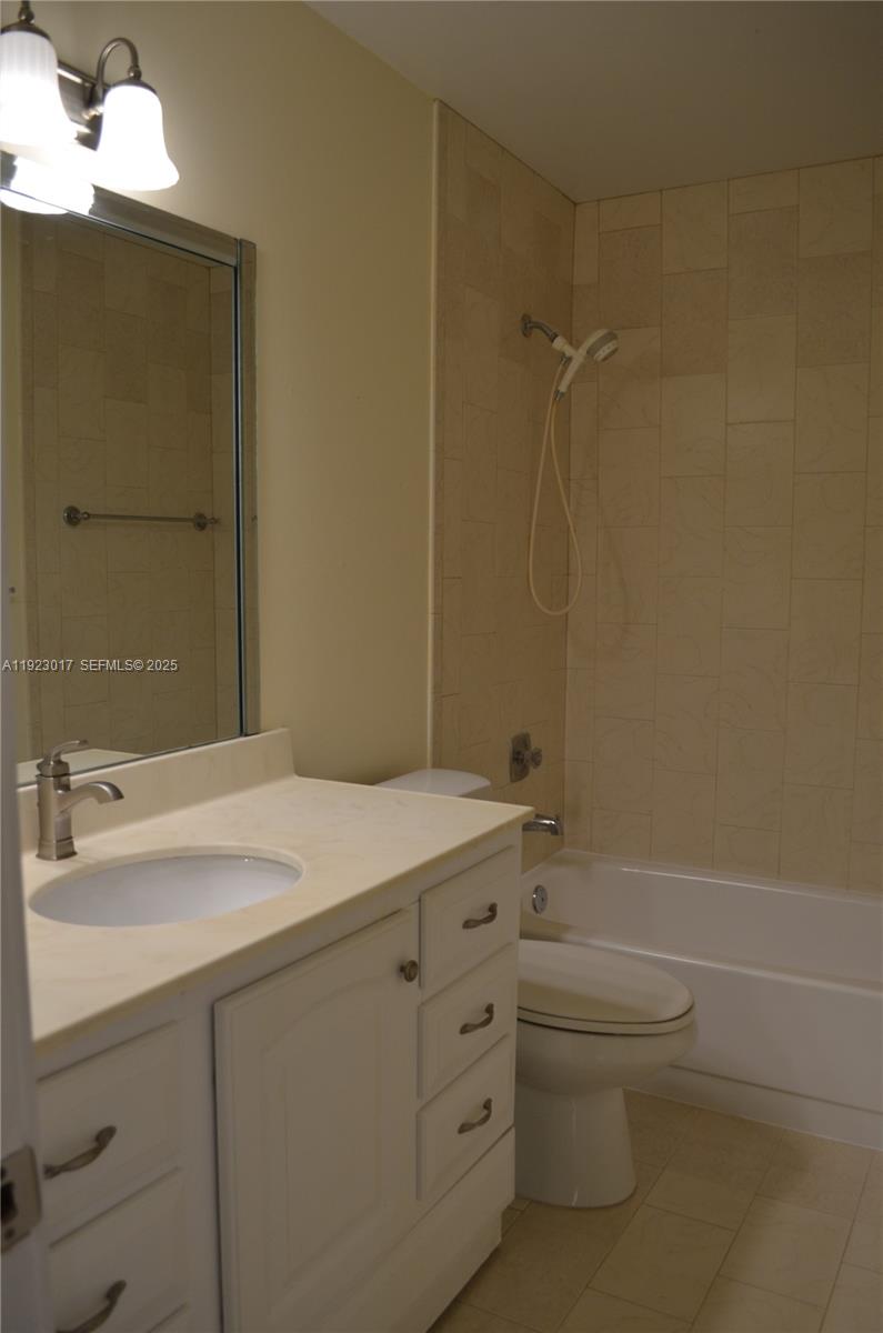 13491 Southwest 99th Terrace Miami, FL 33186 - Photo 32 of 41 a bathroom with a sink a toilet and shower