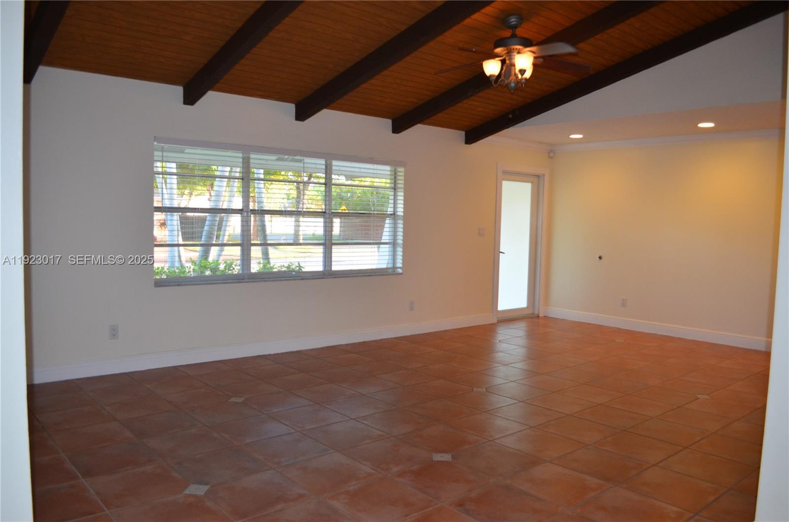 13491 Southwest 99th Terrace Miami, FL 33186 - Photo 4 of 41 a view of an empty room with a window