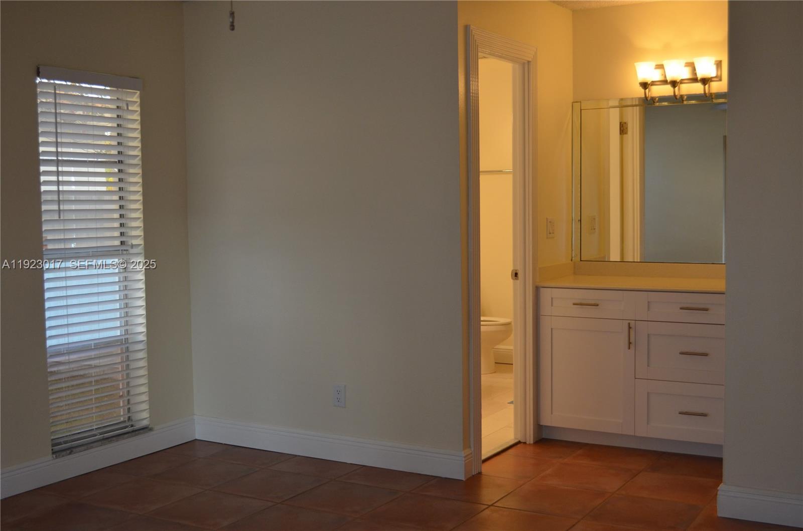 13491 Southwest 99th Terrace Miami, FL 33186 - Photo 6 of 41 an empty room with windows