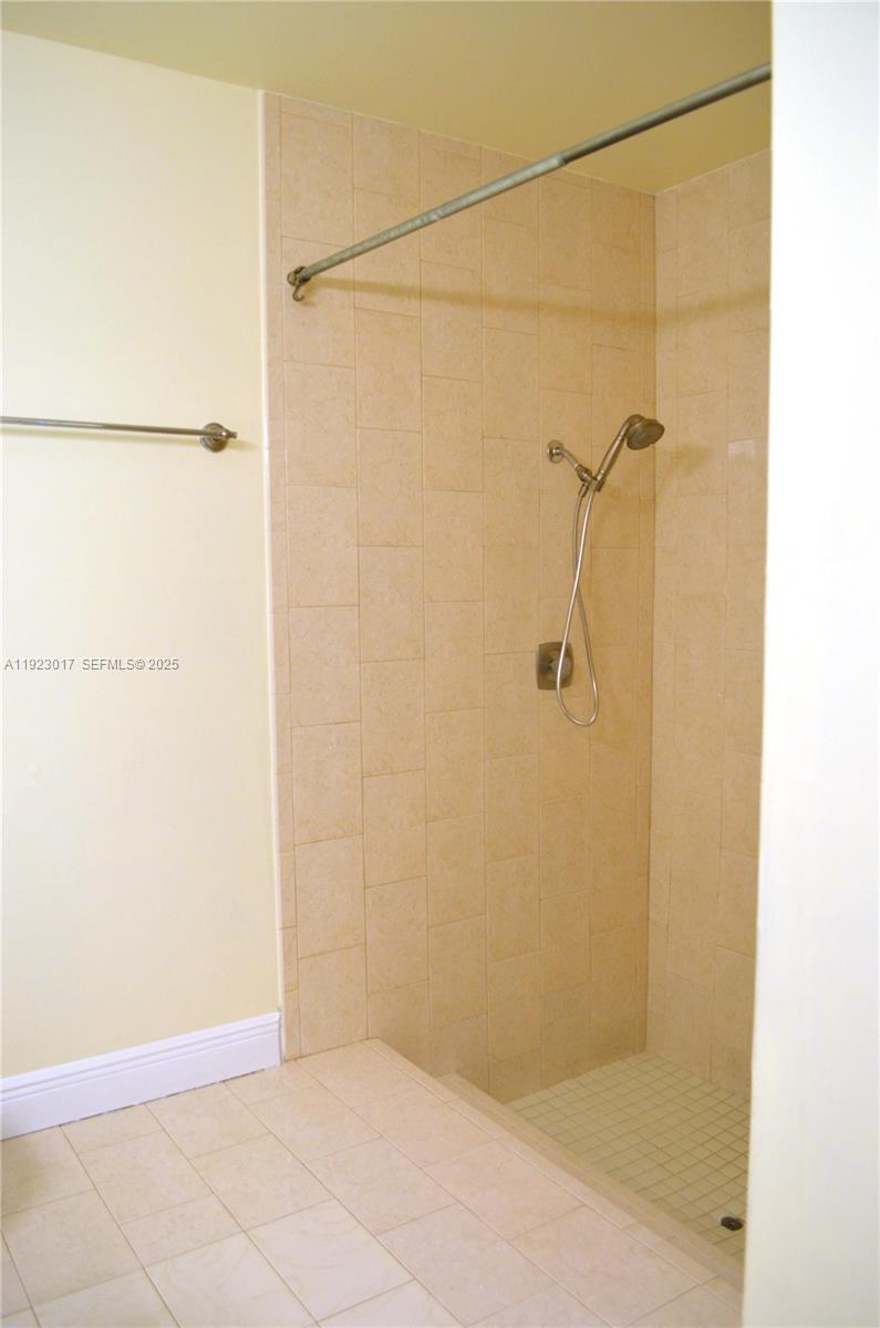 13491 Southwest 99th Terrace Miami, FL 33186 - Photo 9 of 41 a bathroom with a shower