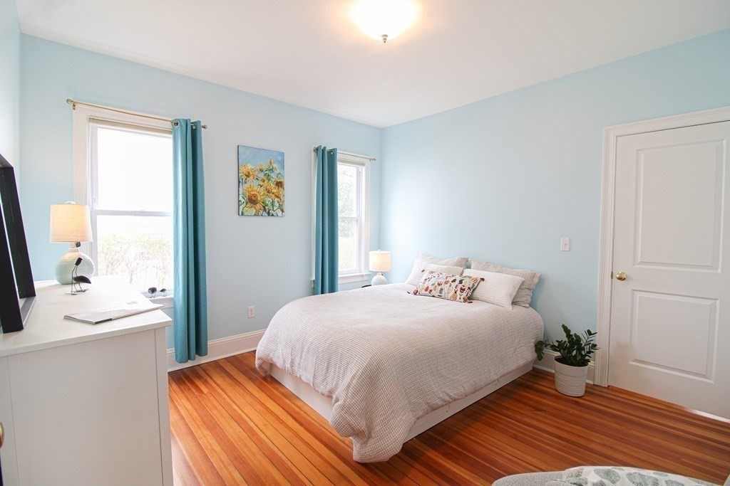 10 Marlboro Street, Unit 1 Belmont, MA 02478 - Photo 11 of 20 a bedroom with a bed and a window