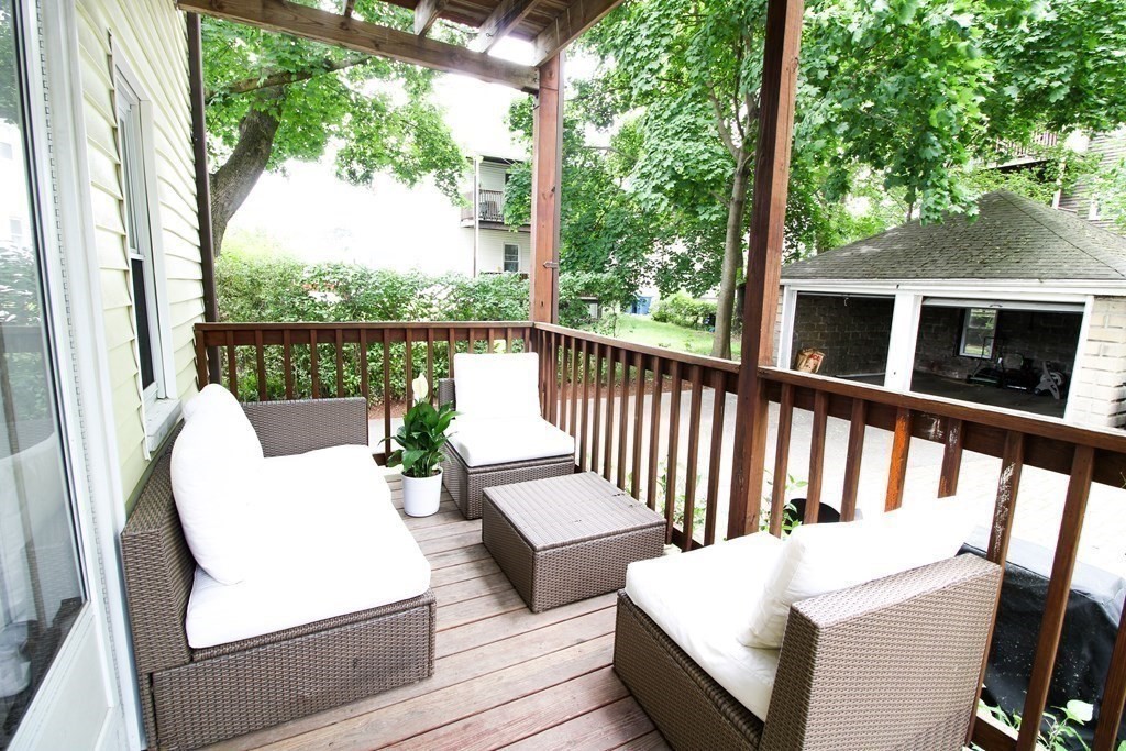 10 Marlboro Street, Unit 1 Belmont, MA 02478 - Photo 15 of 20 a view of a chair and tables in the balcony