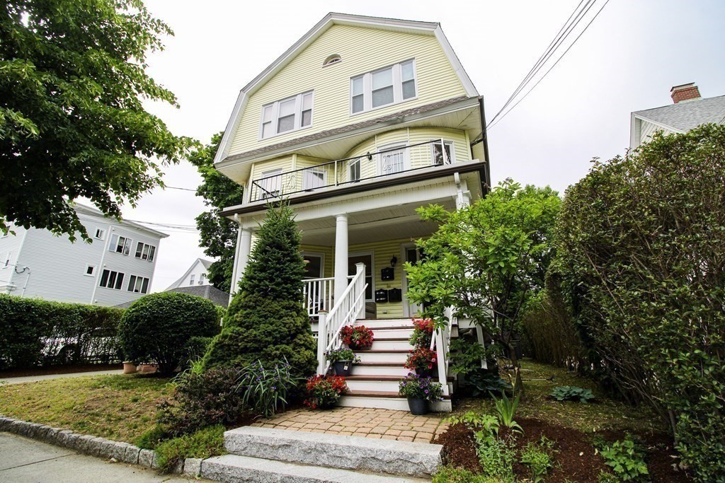 10 Marlboro Street, Unit 1 Belmont, MA 02478 - Photo 17 of 20 a front view of a house with a garden