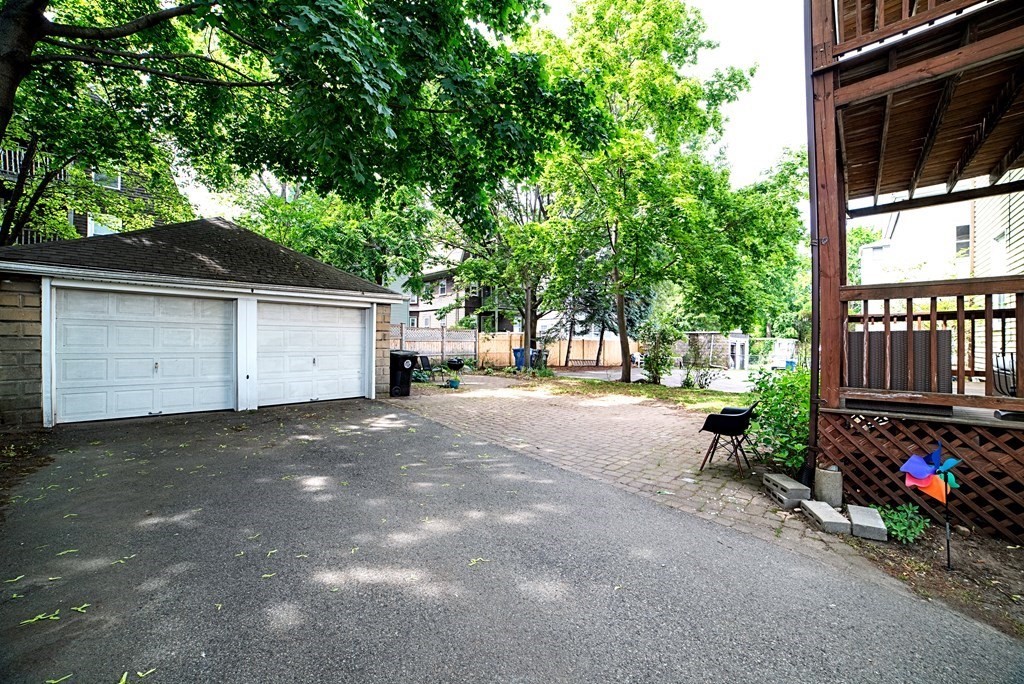 10 Marlboro Street, Unit 1 Belmont, MA 02478 - Photo 19 of 20 a view of a house with backyard and parking
