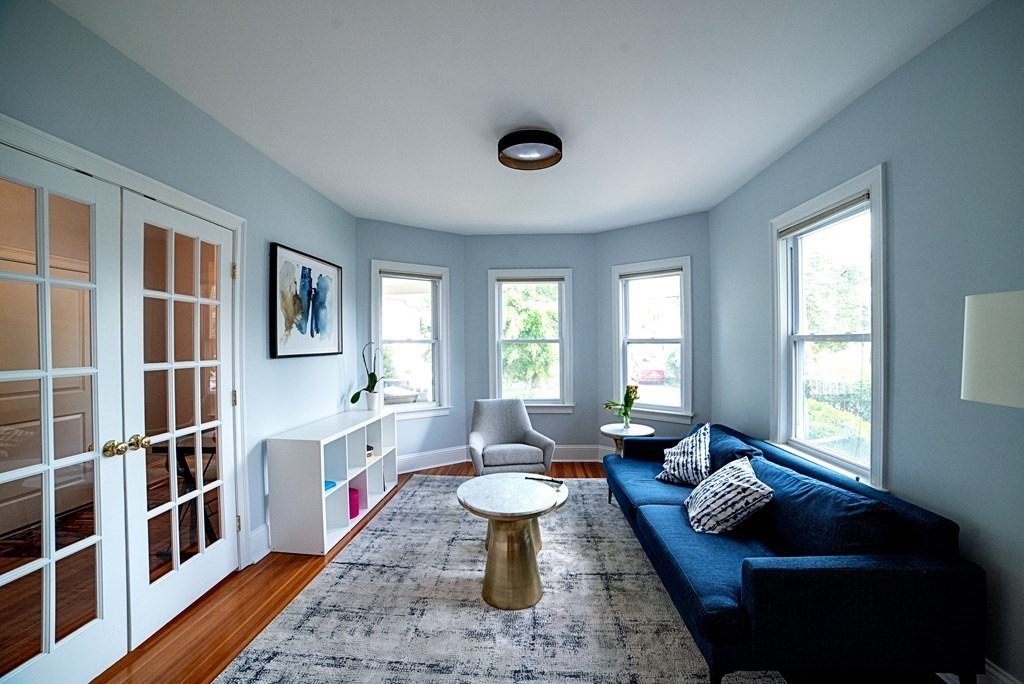 10 Marlboro Street, Unit 1 Belmont, MA 02478 - Photo 4 of 20 a living room with furniture and a window