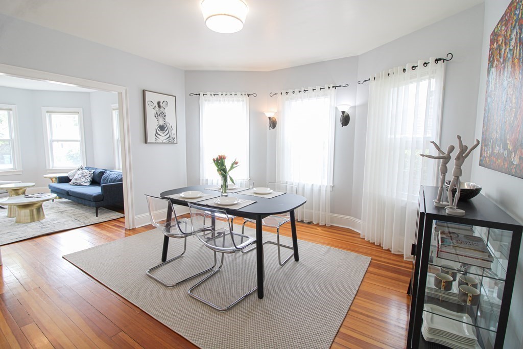 10 Marlboro Street, Unit 1 Belmont, MA 02478 - Photo 6 of 20 a view of a livingroom with furniture window and wooden floor