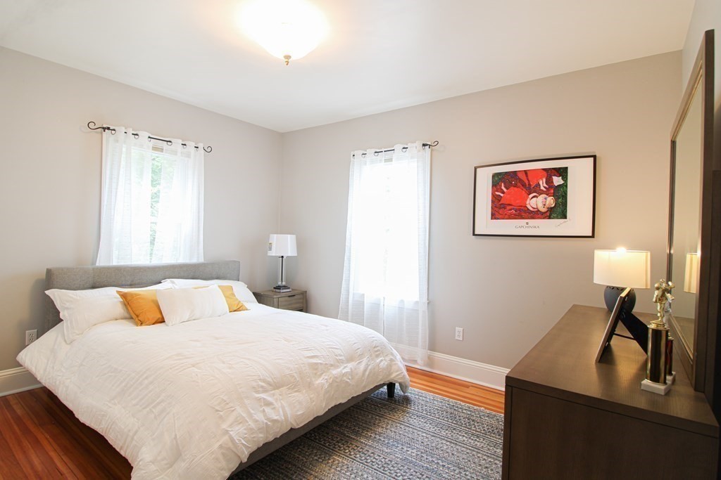 10 Marlboro Street, Unit 1 Belmont, MA 02478 - Photo 9 of 20 a bedroom with a bed and a desk