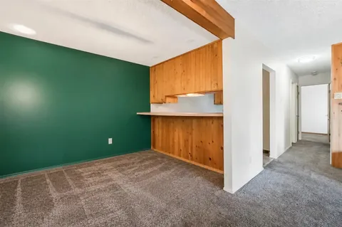 a kitchen with sink cabinets and appliances