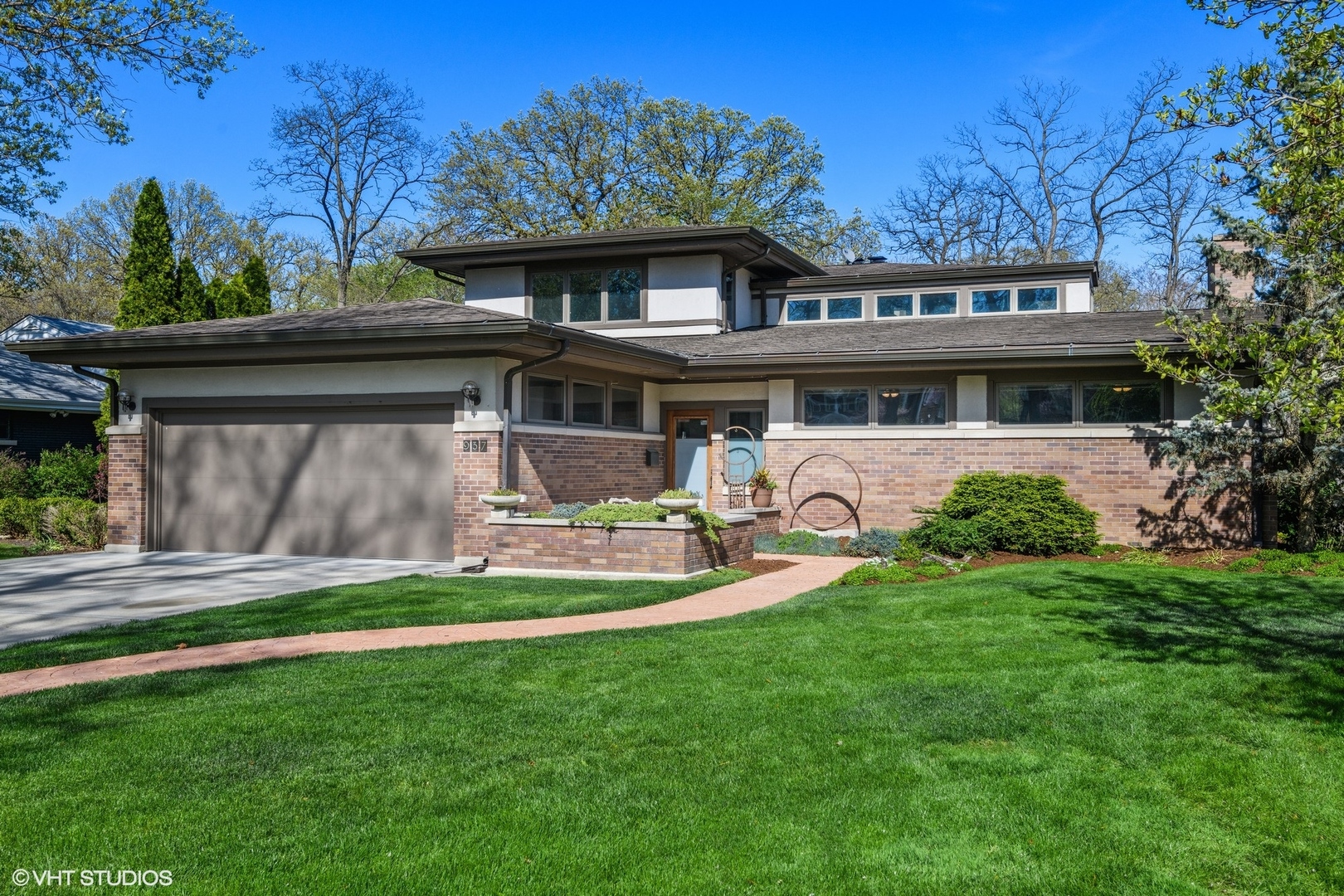 a front view of a house with a yard table and chairs