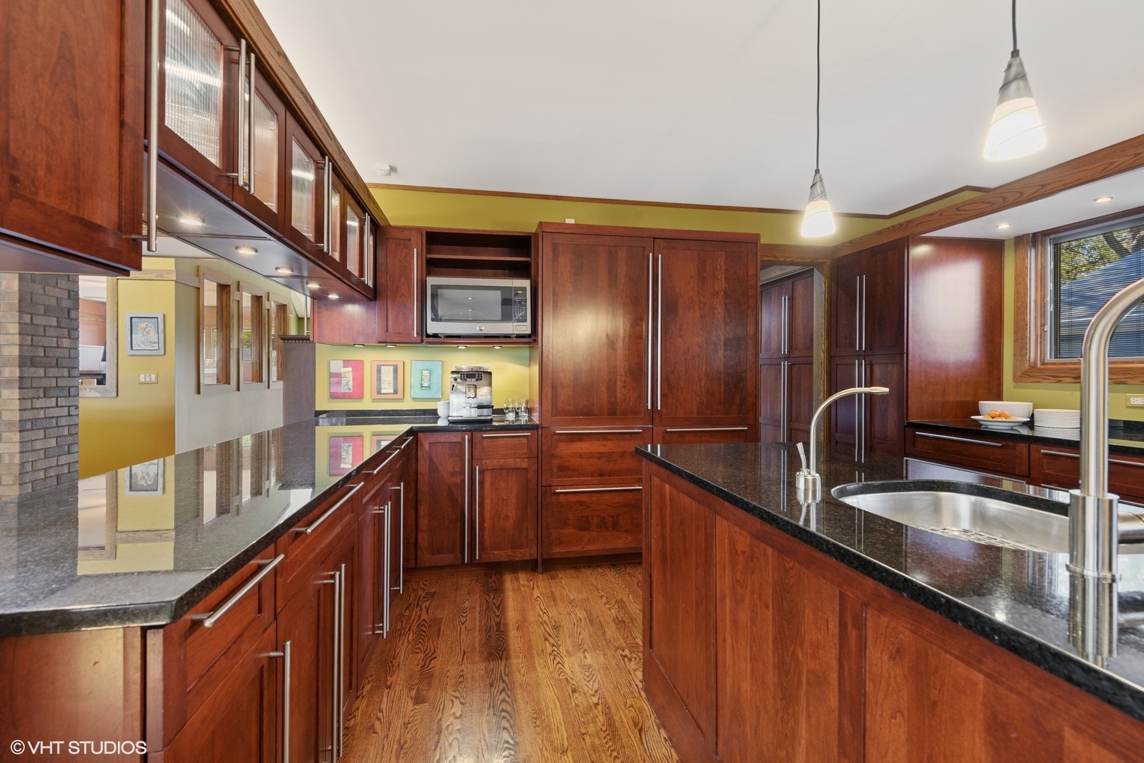 937 Keystone Avenue River Forest, IL 60305 - Photo 10 of 32 a kitchen with stainless steel appliances granite countertop a sink and wooden cabinets