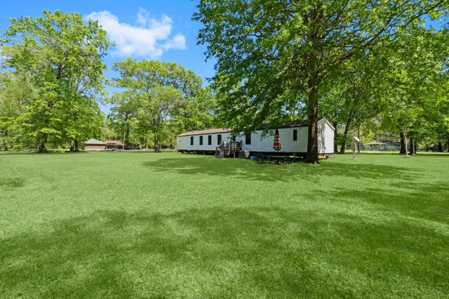 a view of a house with a big yard