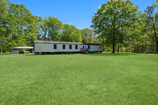 a view of a house with a big yard