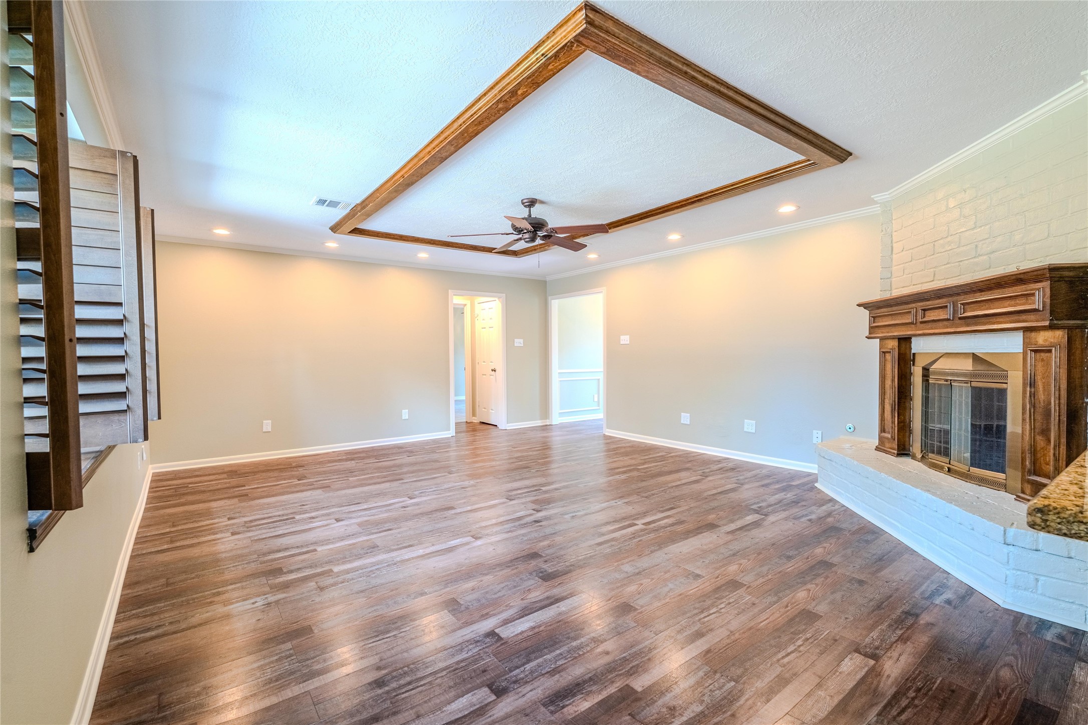 5938 Theall Road Houston, TX 77066 - Photo 16 of 35 a view of empty room with wooden floor and fan