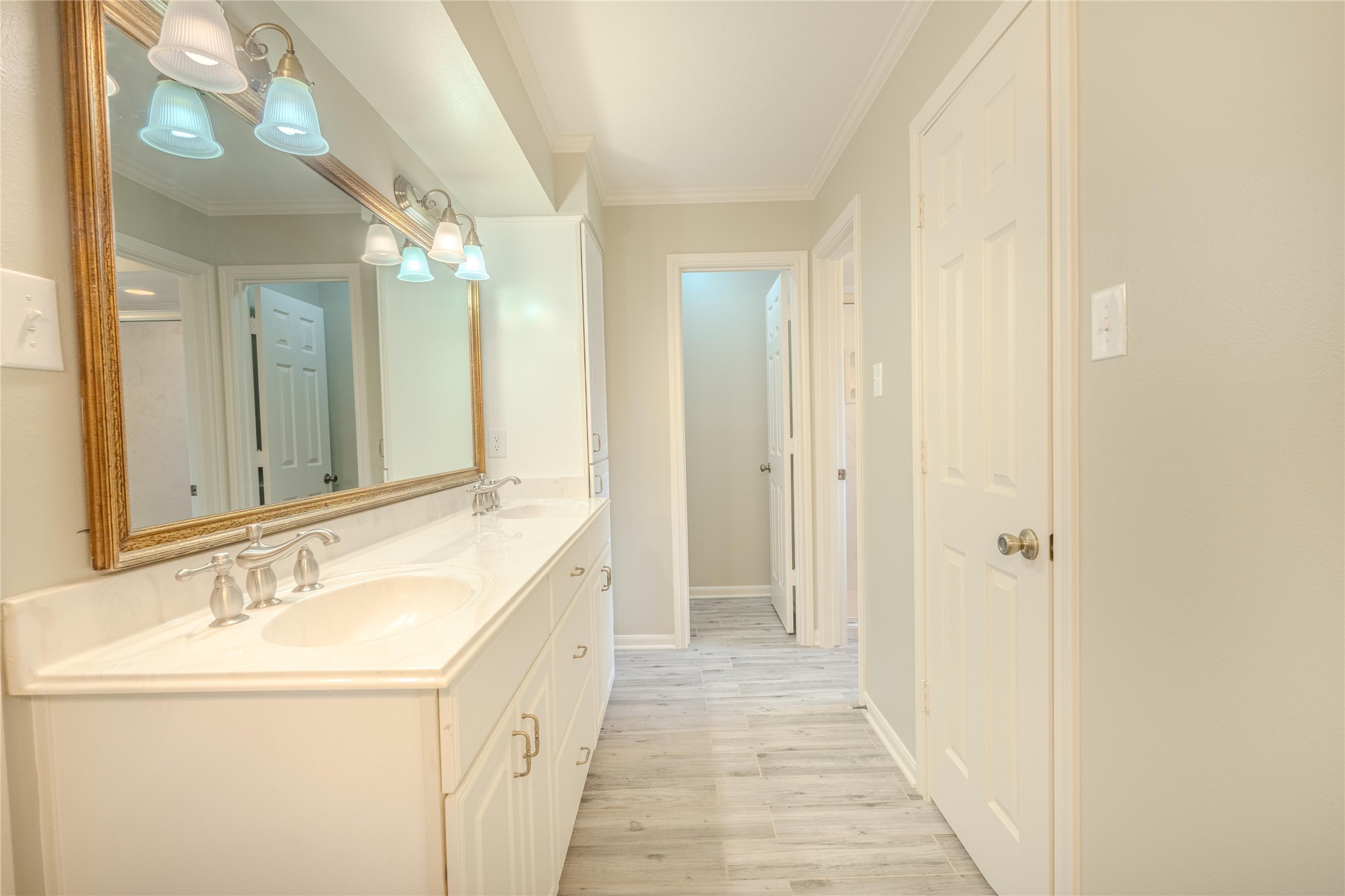 5938 Theall Road Houston, TX 77066 - Photo 20 of 35 a bathroom with a double vanity sink and a mirror