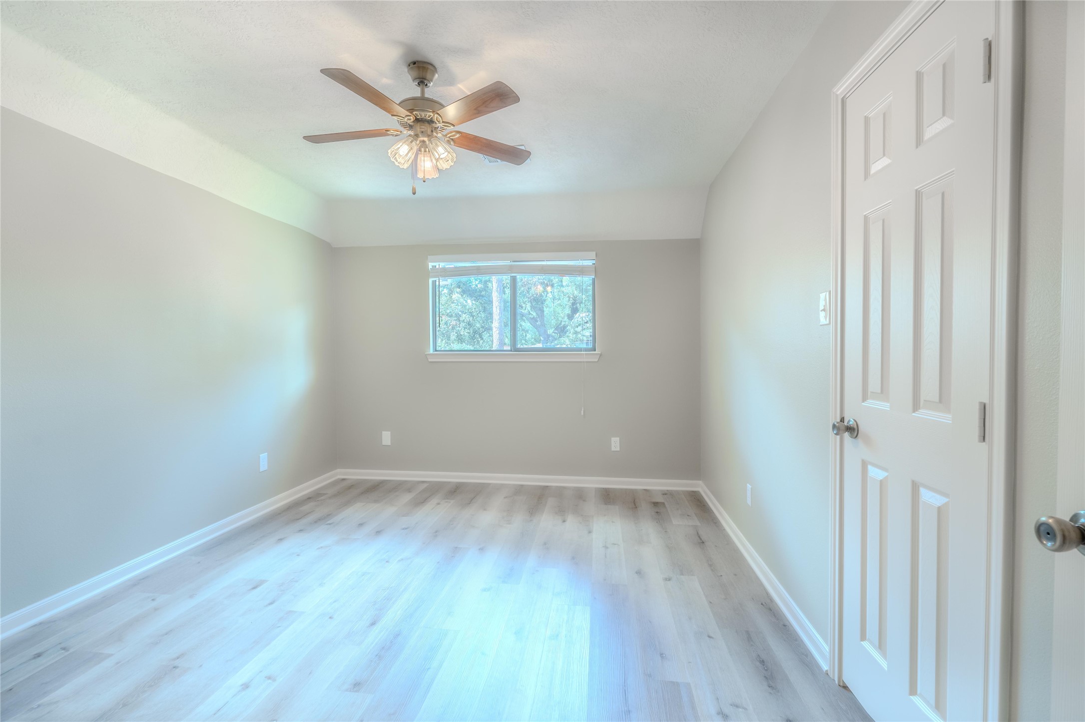 5938 Theall Road Houston, TX 77066 - Photo 28 of 35 wooden floor in an empty room with a window