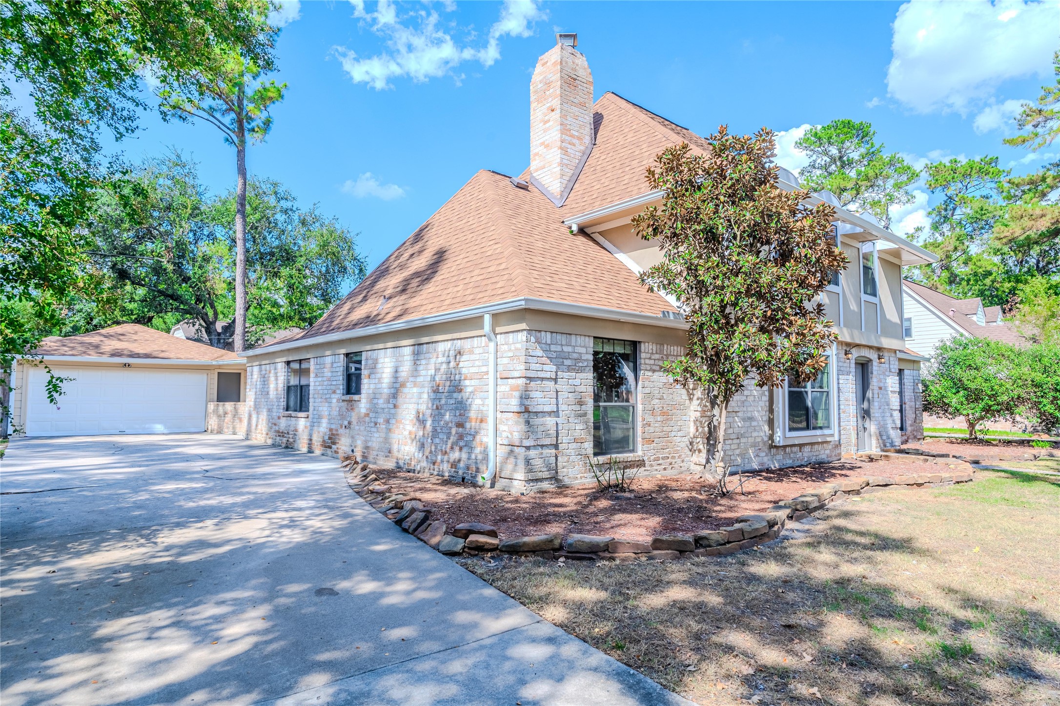 5938 Theall Road Houston, TX 77066 - Photo 3 of 35 a front view of a house with a yard and potted plants