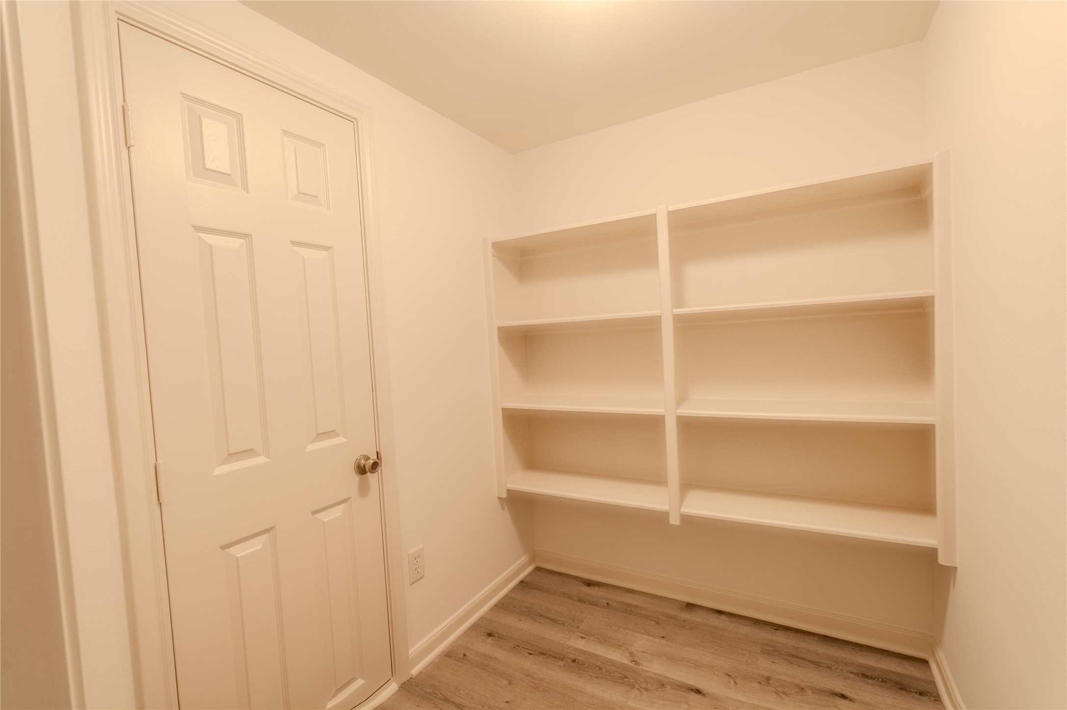 5938 Theall Road Houston, TX 77066 - Photo 32 of 35 a view of an empty walk in closet