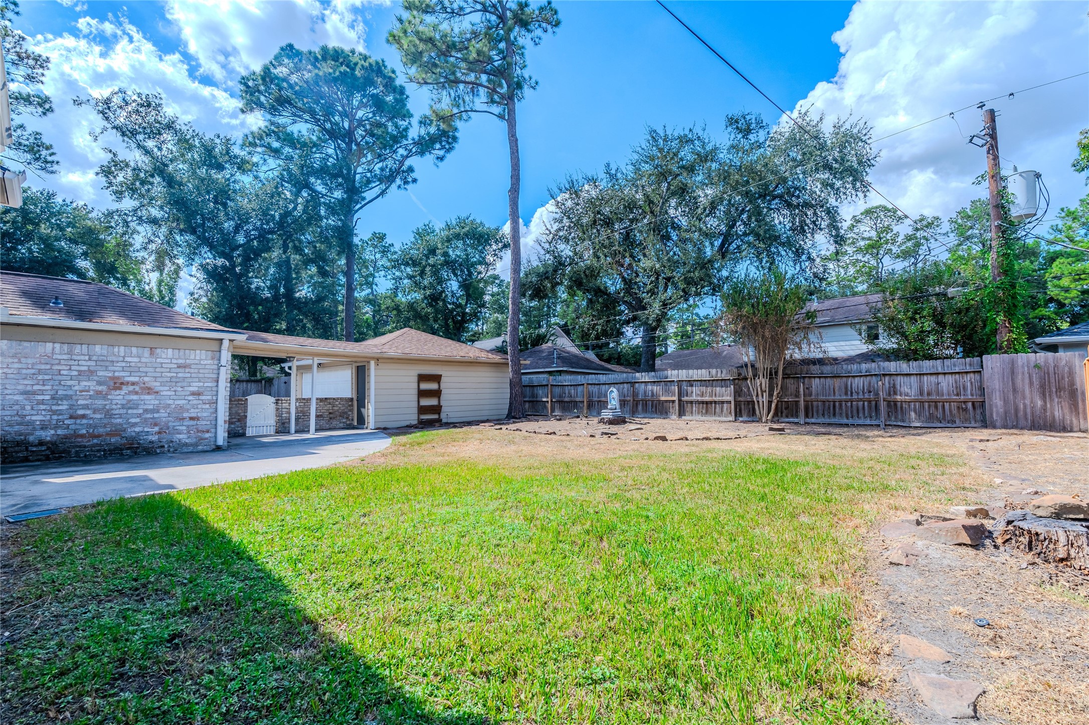 5938 Theall Road Houston, TX 77066 - Photo 34 of 35 a house view with a sitting space and garden