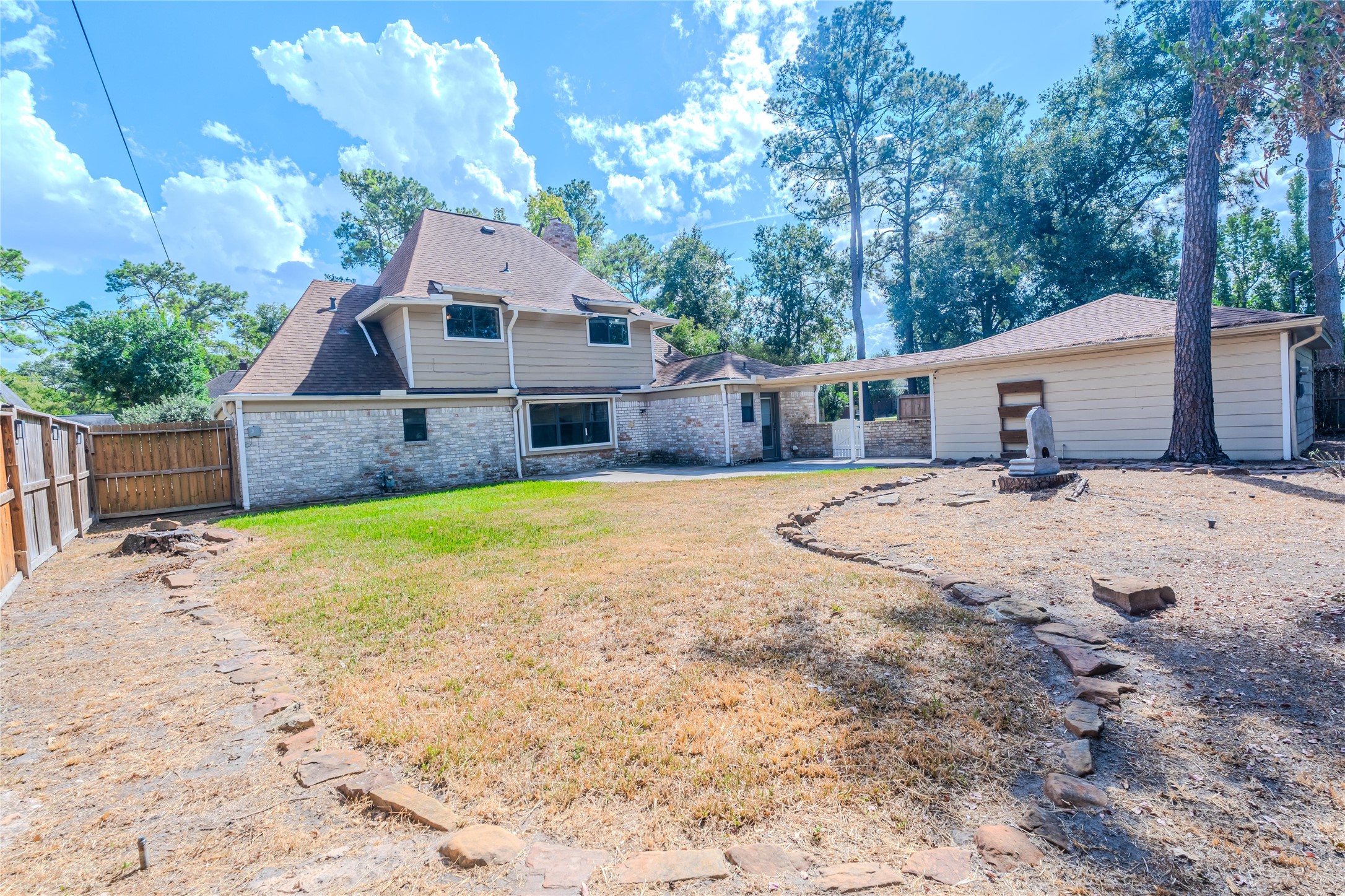 5938 Theall Road Houston, TX 77066 - Photo 35 of 35 a view of house with yard and trees in the background