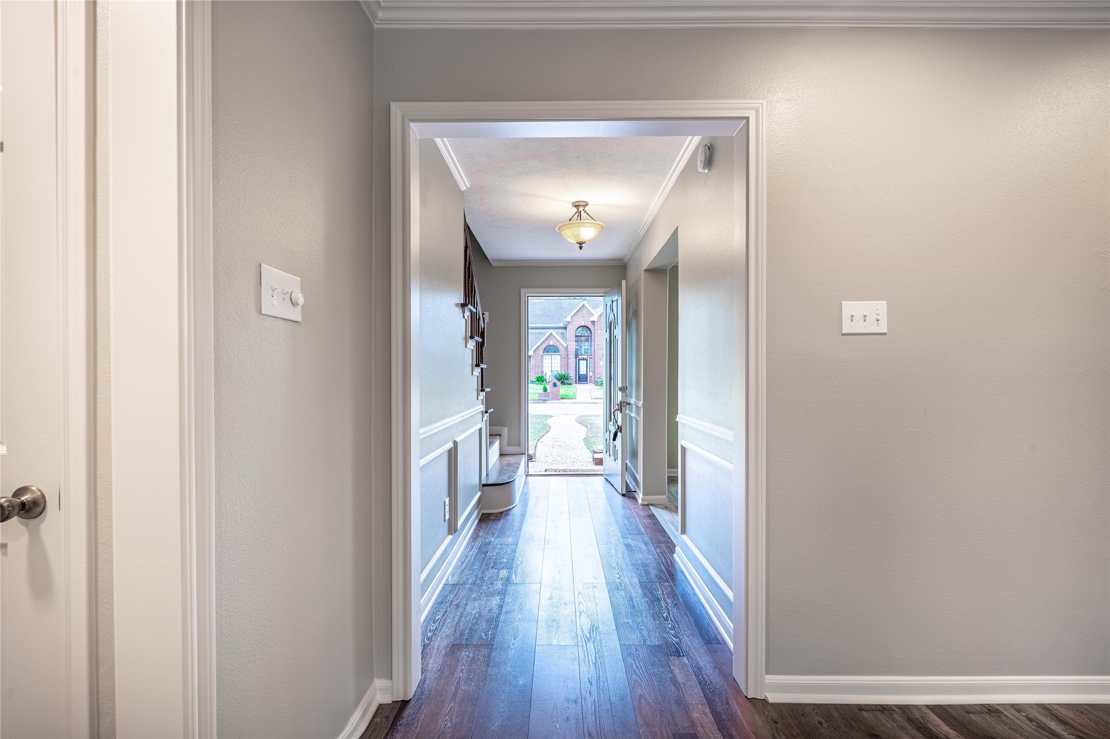 5938 Theall Road Houston, TX 77066 - Photo 4 of 35 a view of a hallway with wooden floor