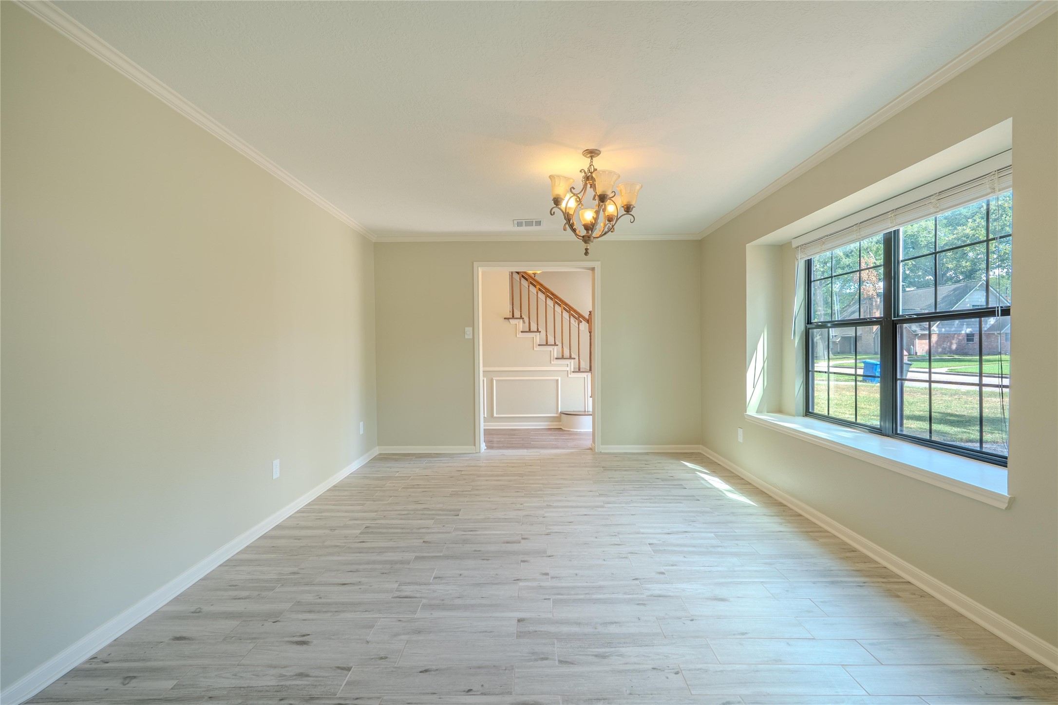 5938 Theall Road Houston, TX 77066 - Photo 8 of 35 a view of an empty room with a window