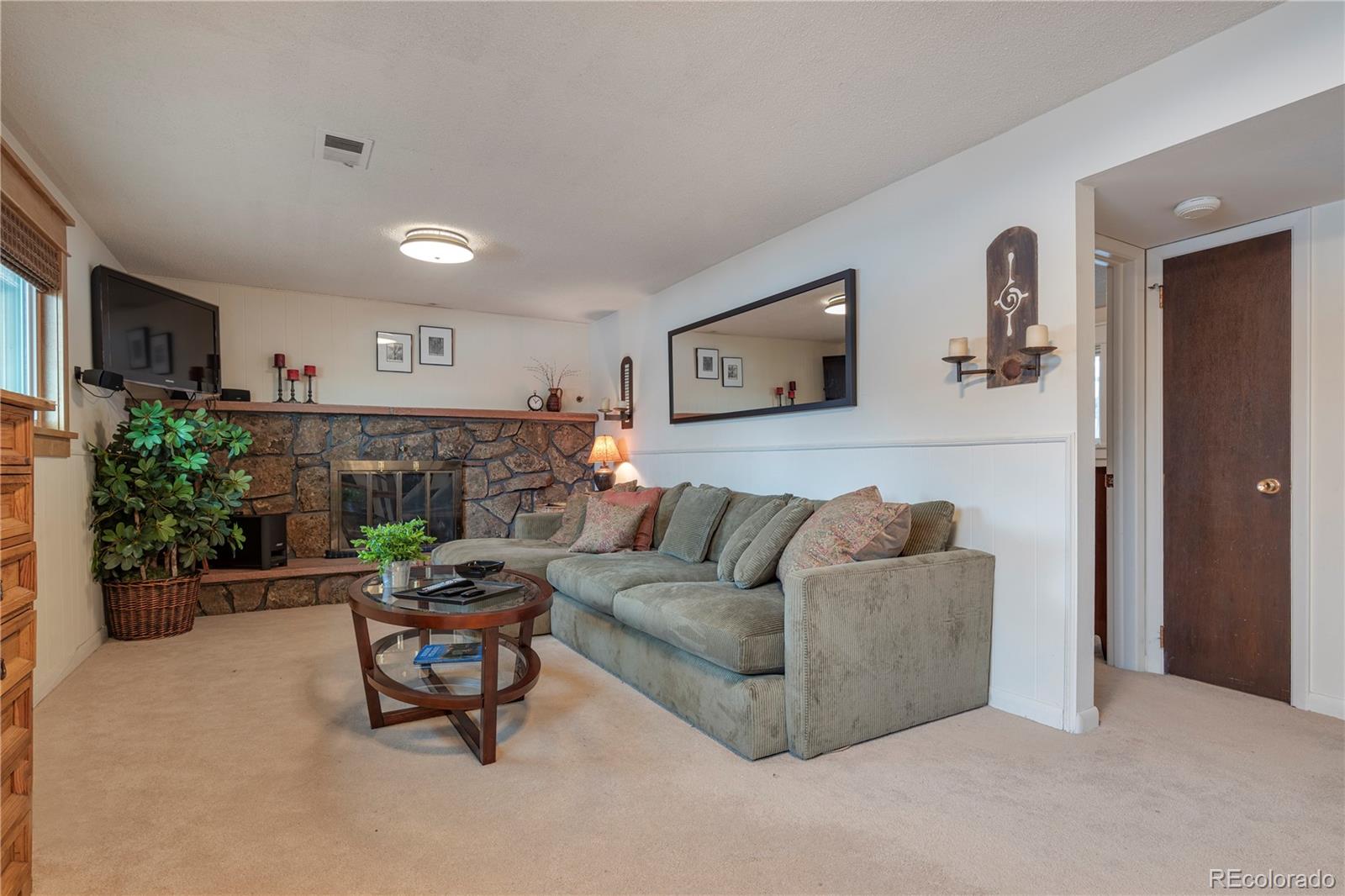 643 Furman Way Boulder, CO 80305 - Photo 15 of 25 a living room with furniture and a fireplace