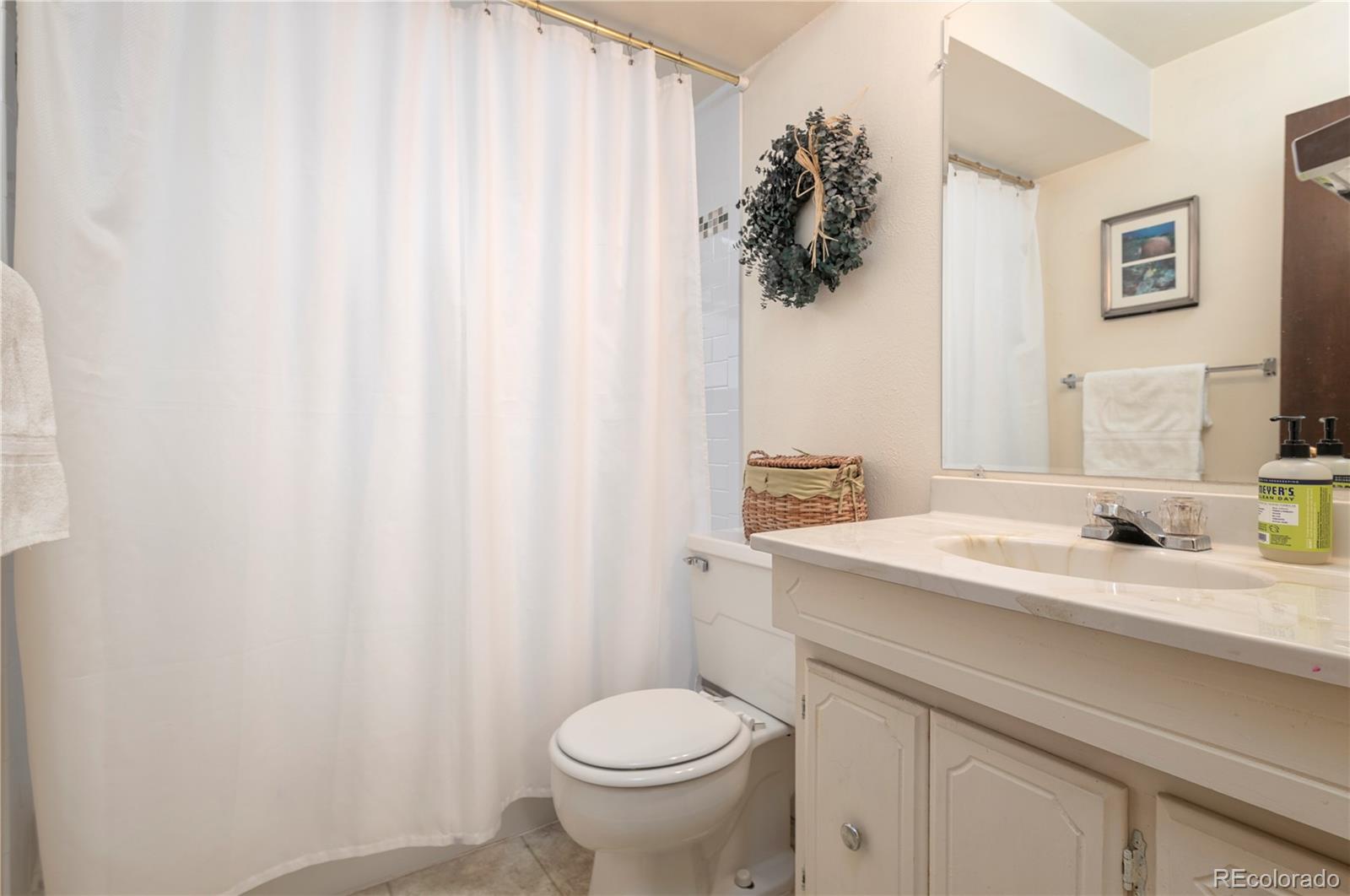643 Furman Way Boulder, CO 80305 - Photo 18 of 25 a bathroom with a sink toilet and vanity