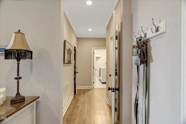 a view of a hallway with a chandelier