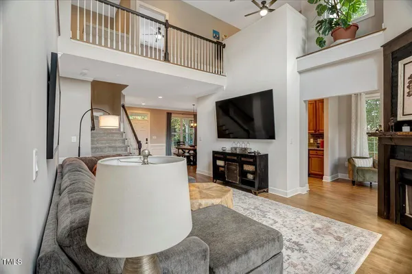 a living room with fireplace furniture and a flat screen tv