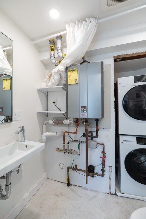 6 Prospect Court Gloucester, MA 01930 - Photo 10 of 26 a bathroom with a sink a mirror and a light fixture